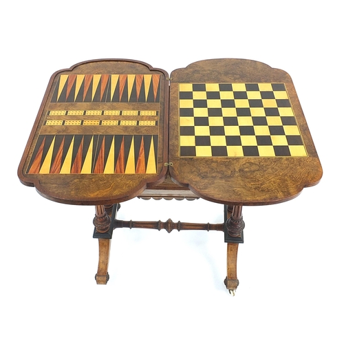 821 - Victorian inlaid burr walnut games table with hinged swivel top revealing chess, backgammon and a cr... 