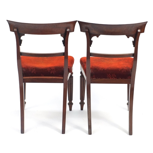 912 - Pair of Victorian mahogany dining chairs with red upholstered stuffover seats, 87cm high