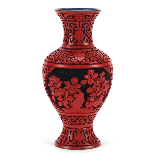 702 - Chinese cinnabar lacquer baluster vase, 20cm high