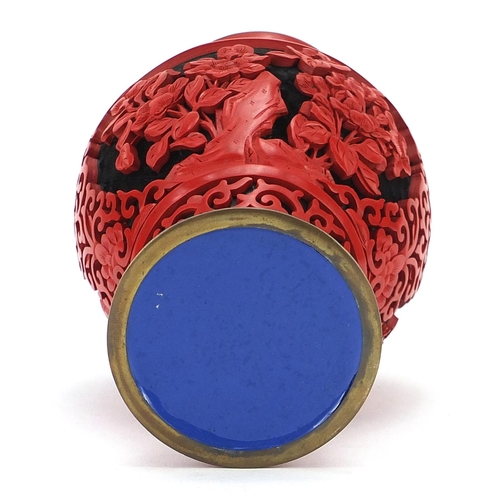 702 - Chinese cinnabar lacquer baluster vase, 20cm high