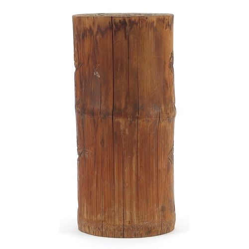 976 - Chinese bamboo brush pot carved with figures amongst trees and pagodas, 25cm high