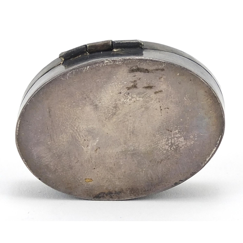 2288 - Oval unmarked silver and enamel pill box with hinged lid, 4cm wide, 17.2g