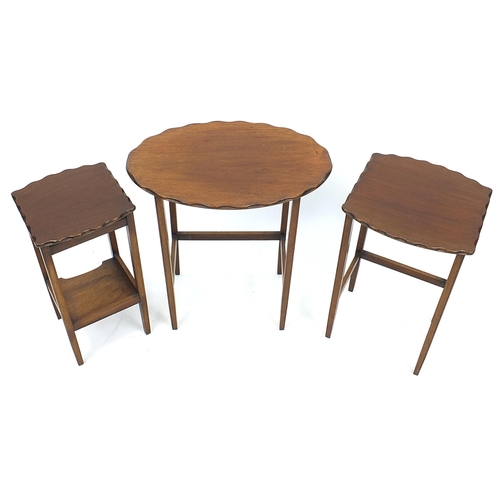 856 - Nest of three mahogany occasional tables with wavy edge, the largest 63cm H x 58cm W x 39.5cm D