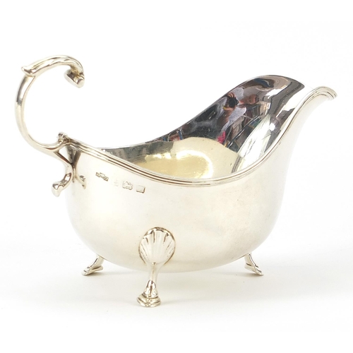 2238 - Asprey & Co Ltd, George V silver sauce boat raised on three hoof feet, Birmingham 1928, 14.5cm in le... 