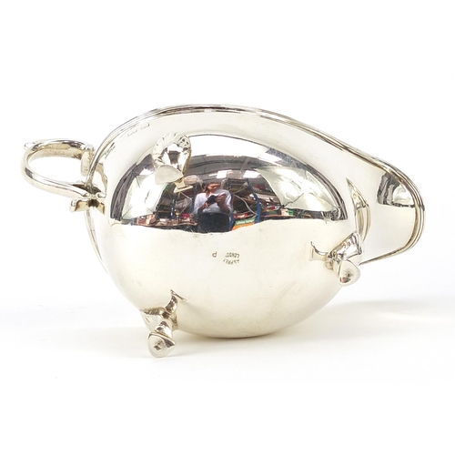 2238 - Asprey & Co Ltd, George V silver sauce boat raised on three hoof feet, Birmingham 1928, 14.5cm in le... 