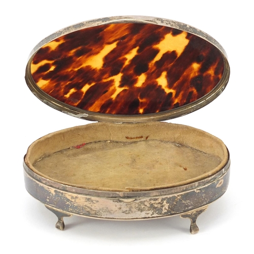 2256 - Adie Brothers Ltd, George V oval silver and tortoiseshell jewel box raised on four feet, Birmingham ... 