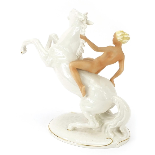 516 - Schaubach Kunst, German porcelain figurine of a nude female on horseback, 26cm high