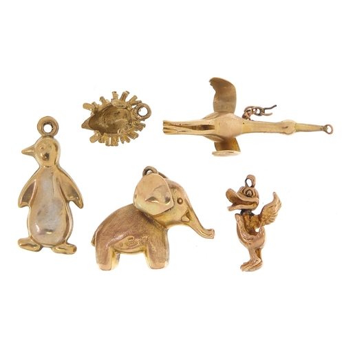 1673 - Five 9ct gold animal charms including elephant, penguin and hedgehog, the largest 3cm in length, tot... 