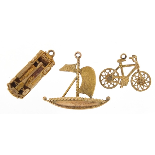 1687 - Three 9ct gold charms comprising sailing boat, classic car and bicycle, the largest 2cm high, total ... 