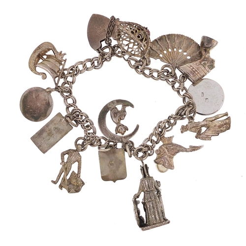 2198 - Silver charm bracelet with selection of mostly silver charms, 46.5g