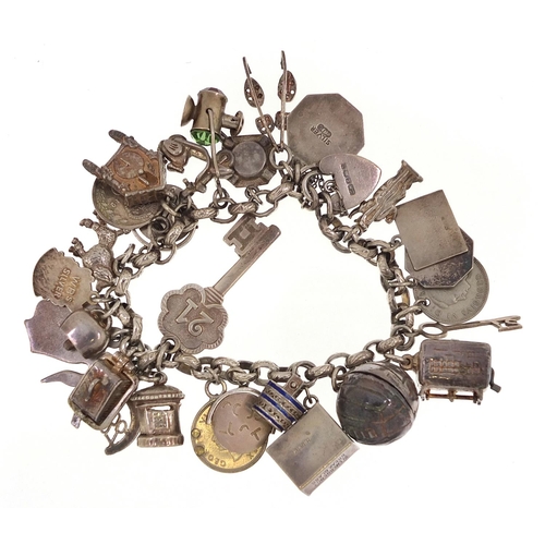 2024 - Silver charm bracelet with a large selection of mostly silver charms, 79.0g