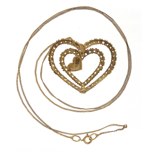 1693 - 9ct gold clear stone love heart pendant on 9ct gold necklace, 2.8cm wide and 46cm in length, 5.3g