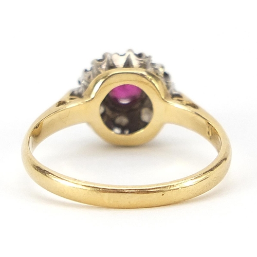 1662 - 18ct gold ruby and diamond cluster ring, size I, 2.7g