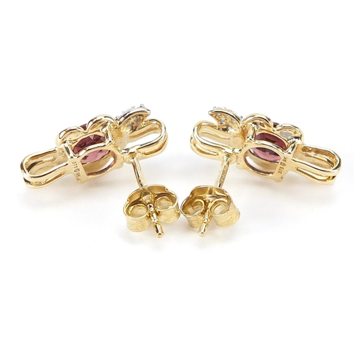 1689 - Pair of 9ct gold pink and clear stone flower head stud earrings, 1.6cm high, 2.7g