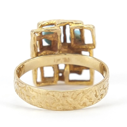 1652 - 9ct gold Modernist ring set with blue stones, size M, 4.3g