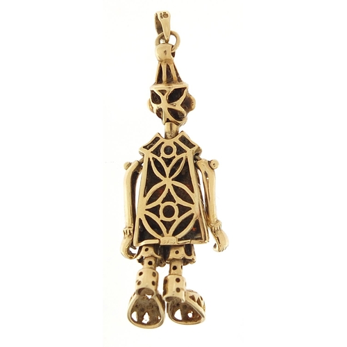 1661 - 9ct gold clown pendant with articulated limbs set with red stones, 4.5cm high, 4.7g