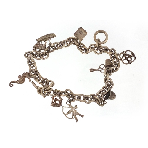 2015 - Silver charm bracelet with a selection of mostly silver charms including seahorse, thimble and cat, ... 