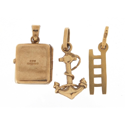 1802 - 18ct gold ladder charm, 9ct gold anchor charm and 9ct gold opening bible charm, the largest 2.1cm hi... 