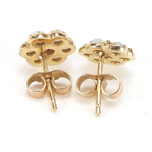 1723 - Pair of 9ct gold opal flower head stud earrings, 9mm in diameter, 1.5g