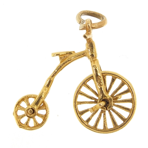 1770 - 9ct gold penny farthing bike charm with rotating wheels, 2.5cm wide, 2.8g