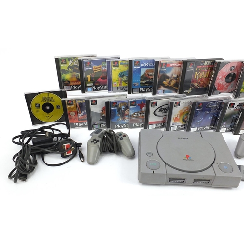 1517 - PlayStation 1 games console with controllers and a collection of games