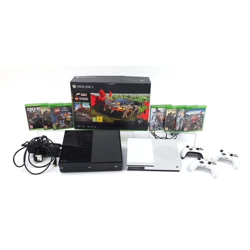 1522 - Xbox One X games console and Xbox One S games console with controllers and a collection of games