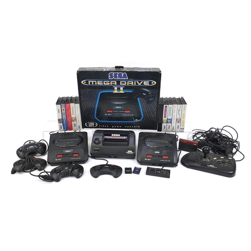 1520 - Two Sega Mega Drive II games consoles and a Sega Master System II powerbase with accessories and a c... 