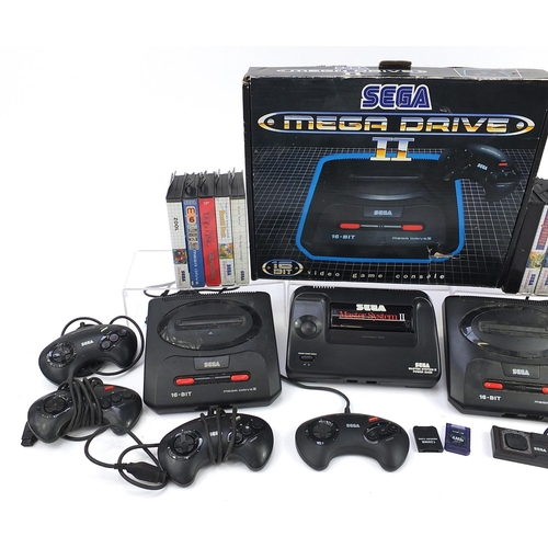 1520 - Two Sega Mega Drive II games consoles and a Sega Master System II powerbase with accessories and a c... 