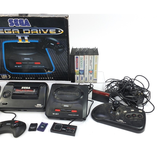 1520 - Two Sega Mega Drive II games consoles and a Sega Master System II powerbase with accessories and a c... 