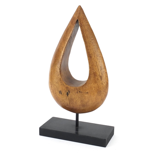 578 - Mid century design carved wood tear drop sculpture raised on a wooden plinth base, 38cm high