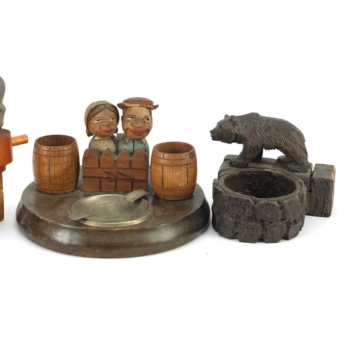 268 - Black Forest carvings including a bear ashtray and mechanical donkey bottle stopper, the largest 15c... 