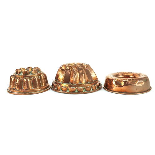 178 - Three Victorian copper jelly moulds, the largest 21.5cm in diameter