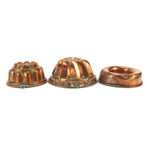 178 - Three Victorian copper jelly moulds, the largest 21.5cm in diameter