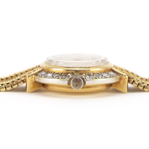 1674 - Corum, 18ct gold and diamond ladies wristwatch with 18ct gold strap, 20mm in diameter, 27.0g