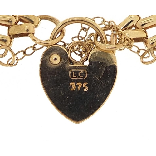 1656 - 9ct gold five row gate bracelet with Elizabeth II 2001 gold half sovereign, 18cm in length, 16.3g