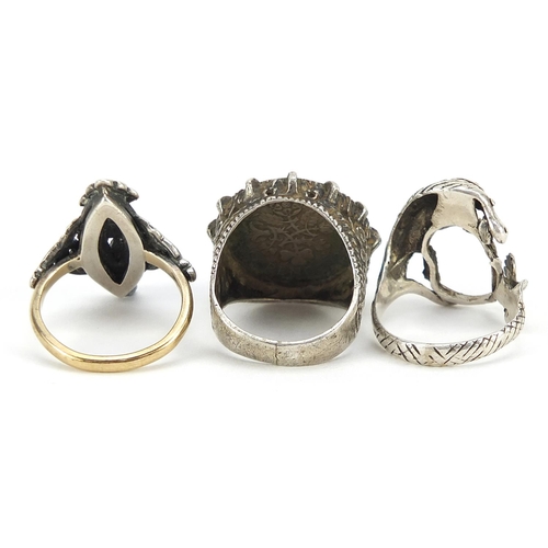 600 - 9ct gold and silver marcasite ring and two other silver rings, sizes N and P, 19.0g