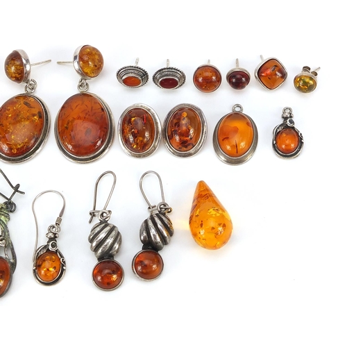 1963 - Collection of silver mounted natural amber earrings, the largest 4.5cm high, total weight 57.4g