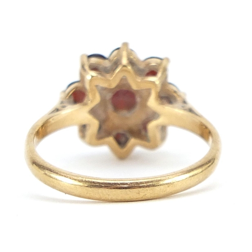 1869 - 9ct gold garnet flower head ring, size O, 3.2g