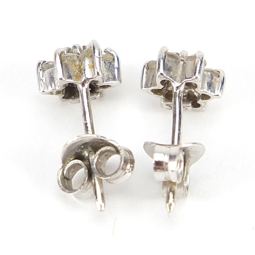 1792 - Pair of 9ct white gold diamond flower head stud earrings, 6mm in diameter, 0.8g