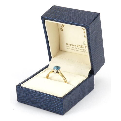 2092 - 18ct gold blue stone tear drop ring, size P/Q, 3.6g