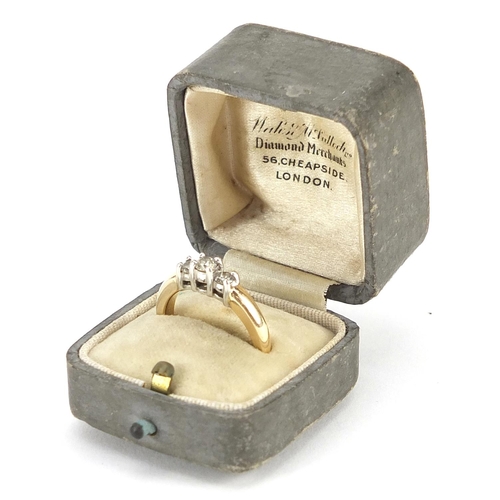 1699 - 14k gold diamond three stone ring housed in Wales & McCulloch London box, size N, 4.6g