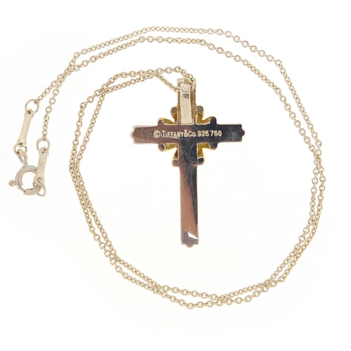 1974 - Tiffany & Co silver and 18ct gold cross pendant on a silver necklace with box, 3.3cm high and 42cm i... 