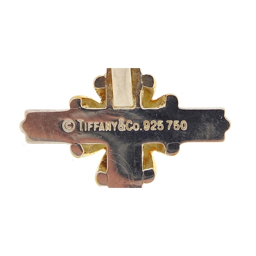 1974 - Tiffany & Co silver and 18ct gold cross pendant on a silver necklace with box, 3.3cm high and 42cm i... 