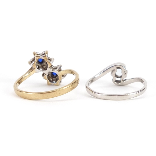 1875 - Two 9ct gold crossover rings set with blue and clear stones, sizes K and N, 3.8g