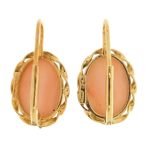 1766 - Pair of 18ct gold cabochon coral earrings housed in a fitted box, 2.3cm high, 5.8g