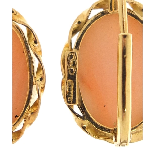 1766 - Pair of 18ct gold cabochon coral earrings housed in a fitted box, 2.3cm high, 5.8g