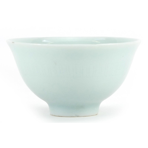 84 - Chinese porcelain tea bowl having a celadon glaze, four figure character marks to the base, 6.5cm in... 