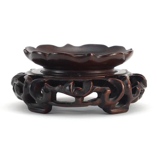 309 - Chinese carved hardwood stand, 8cm in diameter