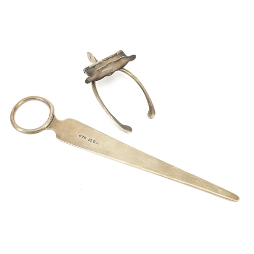 2242 - Barrett & Sons silver letter opener and a silver wishbone letter clip, the largest 17.5cm in length,... 