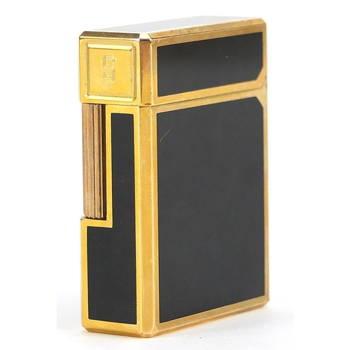 117 - S T Dupont gold plated and black enamel lighter with box and paperwork, numbered K3GS20